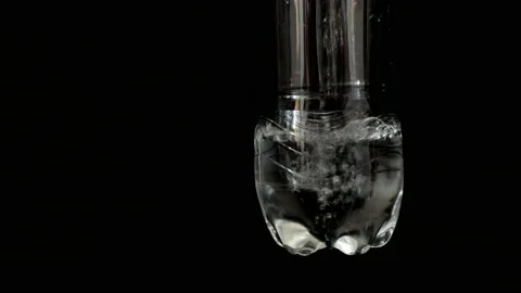 Closeup put water in the plastic bottle black background. Stock Footage 155024564