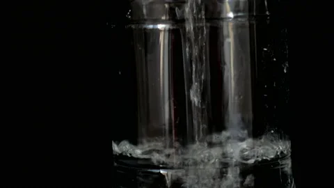 Closeup put water in the plastic bottle black background. Stock Footage 155024877