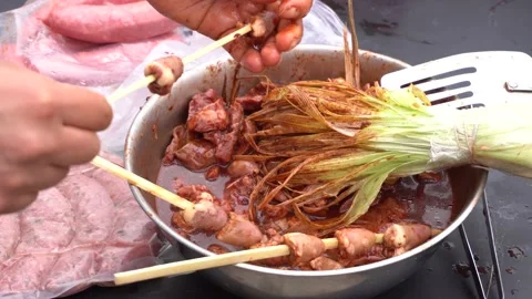 Closeup putting hearts on a toothpick to make a barbecue Stock Footage 143373994