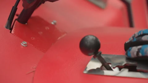 Closeup of Quad Gear Lever. Hand adjusting ATV gear shift with gloves. Person Stock Footage 332051632