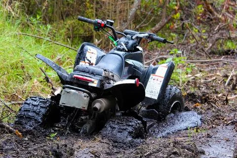 Closeup of a quad stuck in mud Stock Photos
