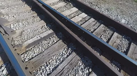 Closeup of Rails, while Walking on Railroad Tracks Video stock 66488871
