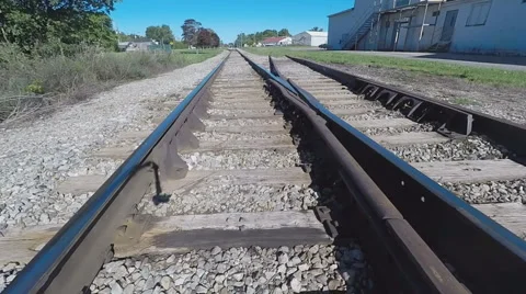 Closeup of Rails, while Walking on Railroad Tracks Video stock 66491562