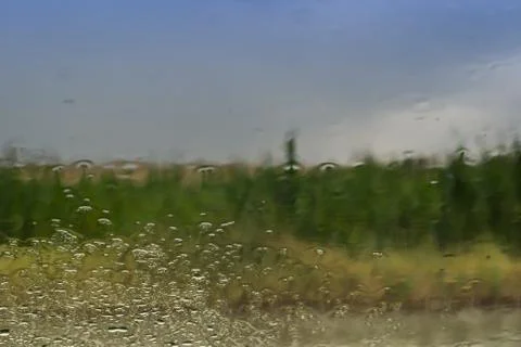 Closeup rain drops abstract pattern on the glass window. Stock Photos