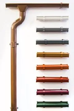 Closeup of rain gutter and drain pipes. Different color options. Stock Photos