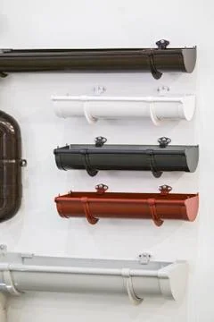 Closeup of rain gutter and drain pipes. Different color options. Stock Photos