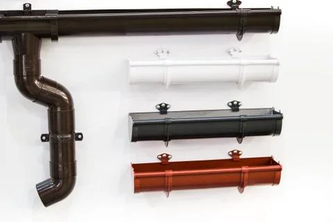 Closeup of rain gutter and drain pipes. Different color options. Stock Photos