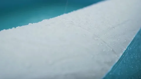 Closeup on rain in pool Stock Footage 136917886