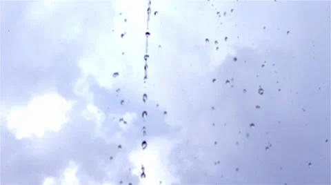 Closeup raindrops falling against sky background 스톡 동영상 25737886