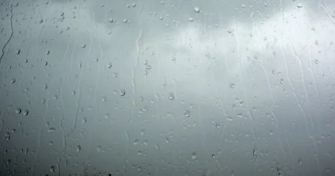 Closeup on raindrops on window Stock Footage 241567134