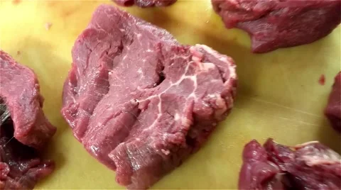 Closeup on raw filet mignon steaks, on a cutting board Stock Footage 54799732