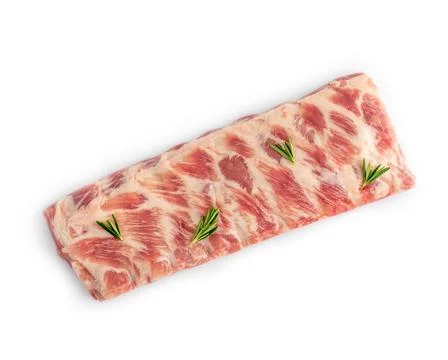 Closeup of raw spare lamb ribs with rosemary on white isolated studio background Stock Photos