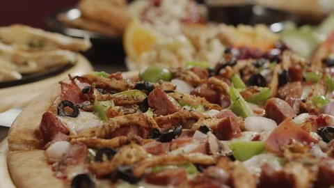 Closeup ready hot salami pizza. Man takes piece of hot pizza with melted cheese Video stock 124069015
