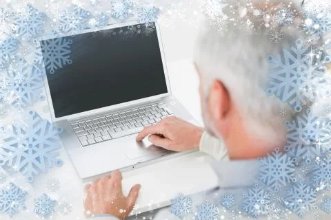 Closeup rear view of a grey haired man using laptop at desk Stock Illustration