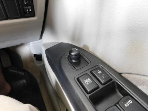 Closeup of rear view mirror switch of a car Stock Photos