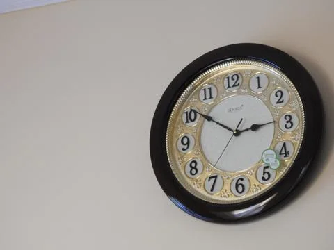 Closeup of Red Analog Solace Wall Clock for home isolated on white background Stock Photos