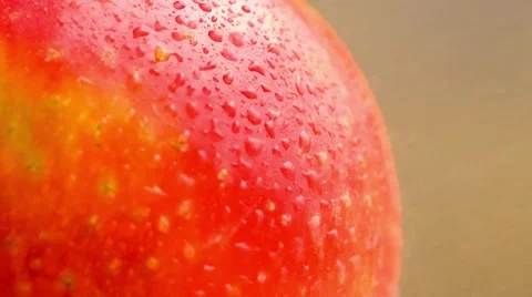 Closeup of red apple fruit with spotty textured skin being splashed with a sp Stock Footage 62715340