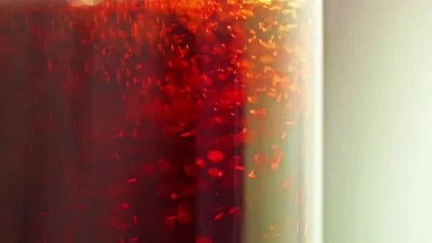 Closeup of red coloured soft drink bubble Stock Footage 303327284