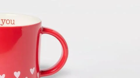 Closeup of red earthenware mug for Valentine’s Day with copy space Fotos de archivo