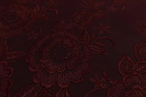 Closeup of red fabric with floral pattern and textile texture background Stockfoto's