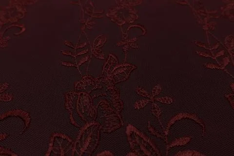 Closeup of red fabric with floral pattern and textile texture background Stock-Fotos