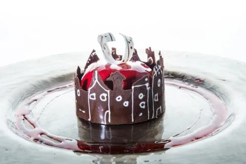 Closeup red glazed mousse cake in apple shape with chocolate Foto stock