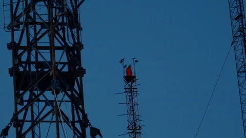 A closeup of the red light bulb on the electricity tower. Light on radio tower Stock Footage 282051540