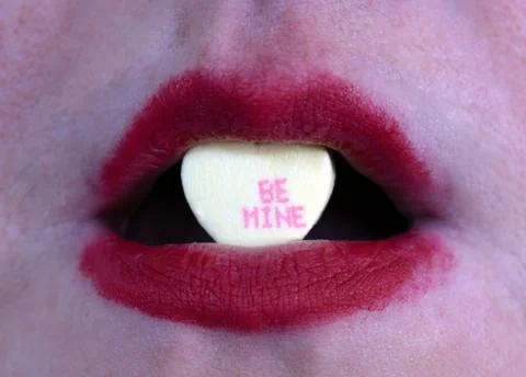 Closeup red lipstick with candy Stock Photos