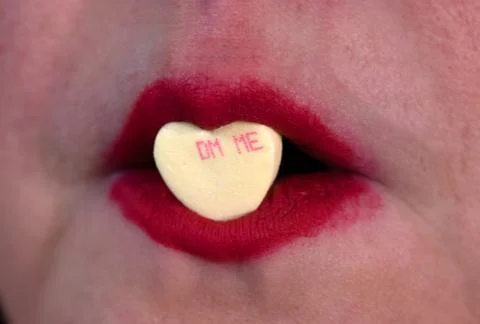Closeup red lipstick with candy Stock Photos
