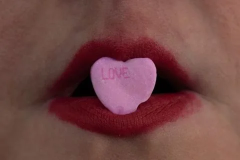 Closeup red lipstick with candy Stock Photos