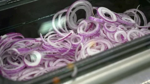 Closeup red onion circle on black box fast food shop Stock Footage 80986576