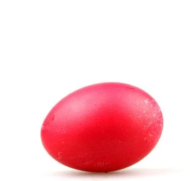 Closeup of a red painted egg for Easter under the lights isolated on a white Stock Photos