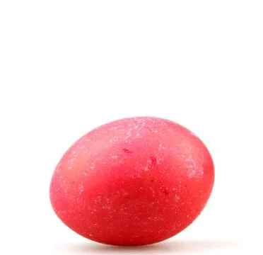 Closeup of a red painted egg for Easter under the lights isolated on a white Stock Photos