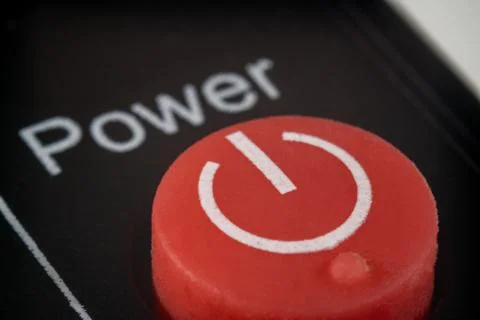 Closeup of red power button on a TV remote Stock Photos