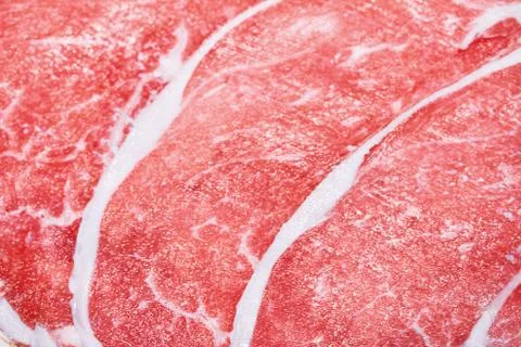 Closeup red raw thinly sliced of pork loin Foto stock