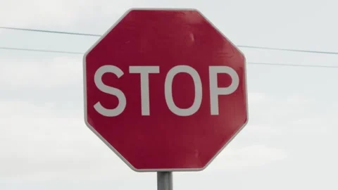Closeup on red road stop sign on street outdoors Stock Footage 267831411