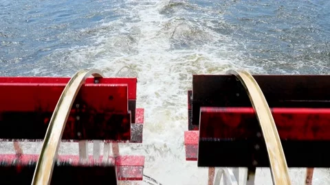Closeup of red rotating paddle wheels of a cruise boat in motion. Stock Footage 202146961