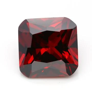 Closeup of a red ruby gemstone isolated on a white background Stock Photos