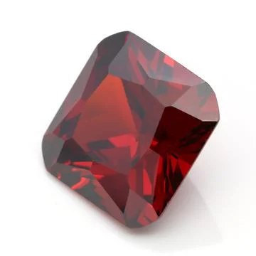 Closeup of a red ruby gemstone isolated on a white background 스톡 사진