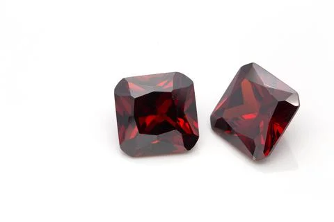 Closeup of red ruby gemstones isolated on a white background 스톡 사진