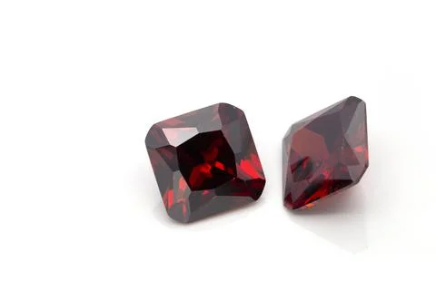 Closeup of red ruby gemstones isolated on a white background Stock Photos