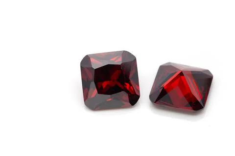 Closeup of red ruby gemstones isolated on a white background Stock Photos