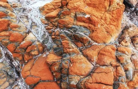 Closeup of a red stone texture background. Stock Photos
