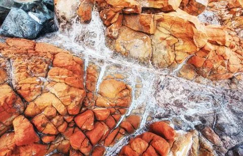 Closeup of a red stone texture background. Fotos de archivo