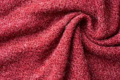 Closeup red texture of woolen knitted fabric. Pattern of red crumpled fabric. Stock Photos