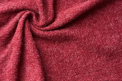 Closeup red texture of woolen knitted fabric. Pattern of red crumpled fabric. Stock Photos