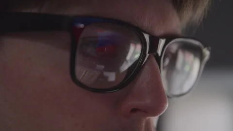 Closeup on the Reflection of a Coding Technician's Glasses Stock Footage 208785316