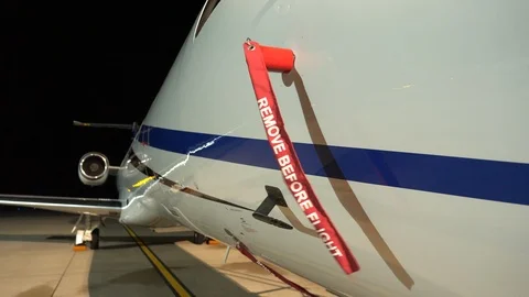 Closeup of a 'Remove Before Flight' tag installed on an ice detector vane Stock Footage 118271230