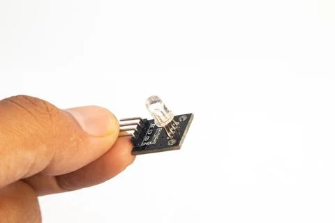 A closeup of an RGB LED module in hand. This module is used for electronics h Stock Photos