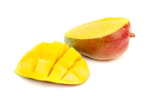 Closeup ripe mango fruit slice with green leaves isolated on white Stock Photos